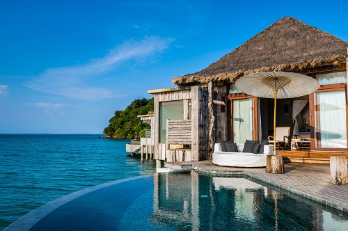Exterior of an overwater villa at Song Saa Private Islands with reclaimed timber
